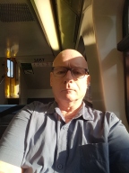 Basking in the sunlight on the train.